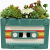 Description
A vibrant 80s-style cassette turned planter that rewinds you straight to the