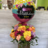 A bright, cheerful mix of colorful blooms designed to celebrate joy, happiness