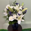A soft and graceful arrangement with creamy tones, delicate accents, and fresh