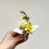 Yellow and white pin on boutonniere. For specific flowers, please comment in