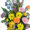A bright and uplifting floral arrangement styled in a glossy yellow duck