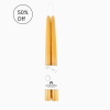 Pair of natural honey-colored taper candles bundled with a white label