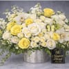 A bright, cheerful bouquet of yellow and white roses creates an instant