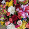 The basket includes a variety of mixed colors and flowers