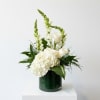 A classic sympathy arrangement in a vase is a timeless and elegant