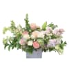 A lush, romantic arrangement designed in a rustic wood box, featuring soft