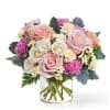 This charming bouquet features delicate pink Roses, complemented by white spray roses
