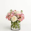 Pink and white bouquet in a clear glass vase
