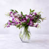A dramatic spray of purple-and-white dendrobium orchids makes a memorable birthday bouquet
