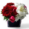 Pretty and sweet bouquet with roses and orchids arranged in a modern