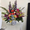 A tall, joyful statement in purple, pink, blue and yellow-this flower arrangement