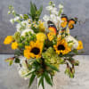 Sunflowers steal the show in this sunny flower arrangement, a cheerful birthday