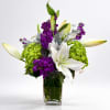 A romantic, high-contrast bouquet blending crisp whites and vibrant jewel tones, partially