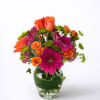 A vibrant, compact arrangement bursting with warm and bold tones, featuring bright