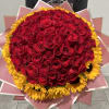 Large bouquet of red roses with a yellow sunflower border