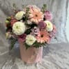 Pink and white mixed bouquet in a round pink box
