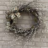 This beautiful wreath made of pussy willow branches and a gorgeous bow