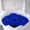 A stunning arrangement of 12 premium blue roses wrapped in elegant white