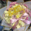 Bouquet of pale roses with a pink ribbon and 