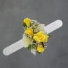 Sunny yellow roses take center stage in this yellow corsage, a cheerful