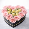 A stunning heart-shaped arrangement featuring premium pink roses paired with Ferrero Rocher