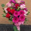 This stunning floral arrangement features a romantic blend of soft pink and