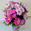 Soft, romantic, and effortlessly elegant, this charming arrangement features a graceful blend