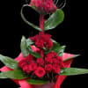 A dramatic, sculptural rose arrangement that reads as a bold romantic statement
