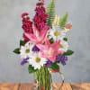 Two large pink lilies take center stage in this Mom's Garden Glow