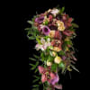 A dramatic cascading bouquet designed for a wedding or special event, this