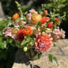 All shades of orange for this summer cutie. Featuring dahlias, shimmer roses