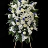 Blu and white standing spray with mixed flowers. 