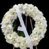 All white wreath with mixed flowers. 