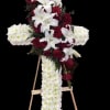 Red and white cross with rose and lily cluster.