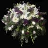 Purple, lavender and white mixed flower casket.
