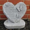 Heart-shaped memorial stone with butterflies and an engraved sympathy message