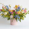 Colorful mixed bouquet in a pink vase