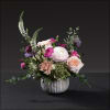 A gorgeous mix of hydrangea, ranunculus, antique carnations, roses, scabiosa, veronica, accented