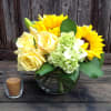 A burst of Sunflowers with yellow Roses and Hydrangea in a bubble