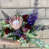 A divine gift where the Queen Protea is the star. Nestled in