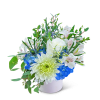 White and blue floral arrangement in a white container