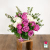 Pink roses and white hydrangeas in a glass vase