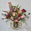 Pink and red mixed bouquet in a clear glass vase