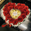 Heart-shaped rose arrangement with Ferrero Rocher chocolates in the center