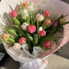 The Happy Wrap is a cheerful bouquet of fresh vibrant tulips, beautifully