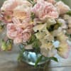 Blush pink and cream bouquet in a glass vase
