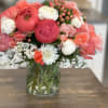 Pink and white mixed bouquet in a clear glass vase