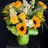 Sun-soaked and cheerful, this more traditional-style arrangement will brighten the home or