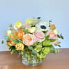 Mixed pastel bouquet in a clear glass vase