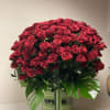 Large bouquet of red roses in a striped vase